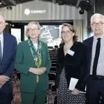 Stéphane Boujnah avec trois responsables lors d’une conférence Euronext à Paris